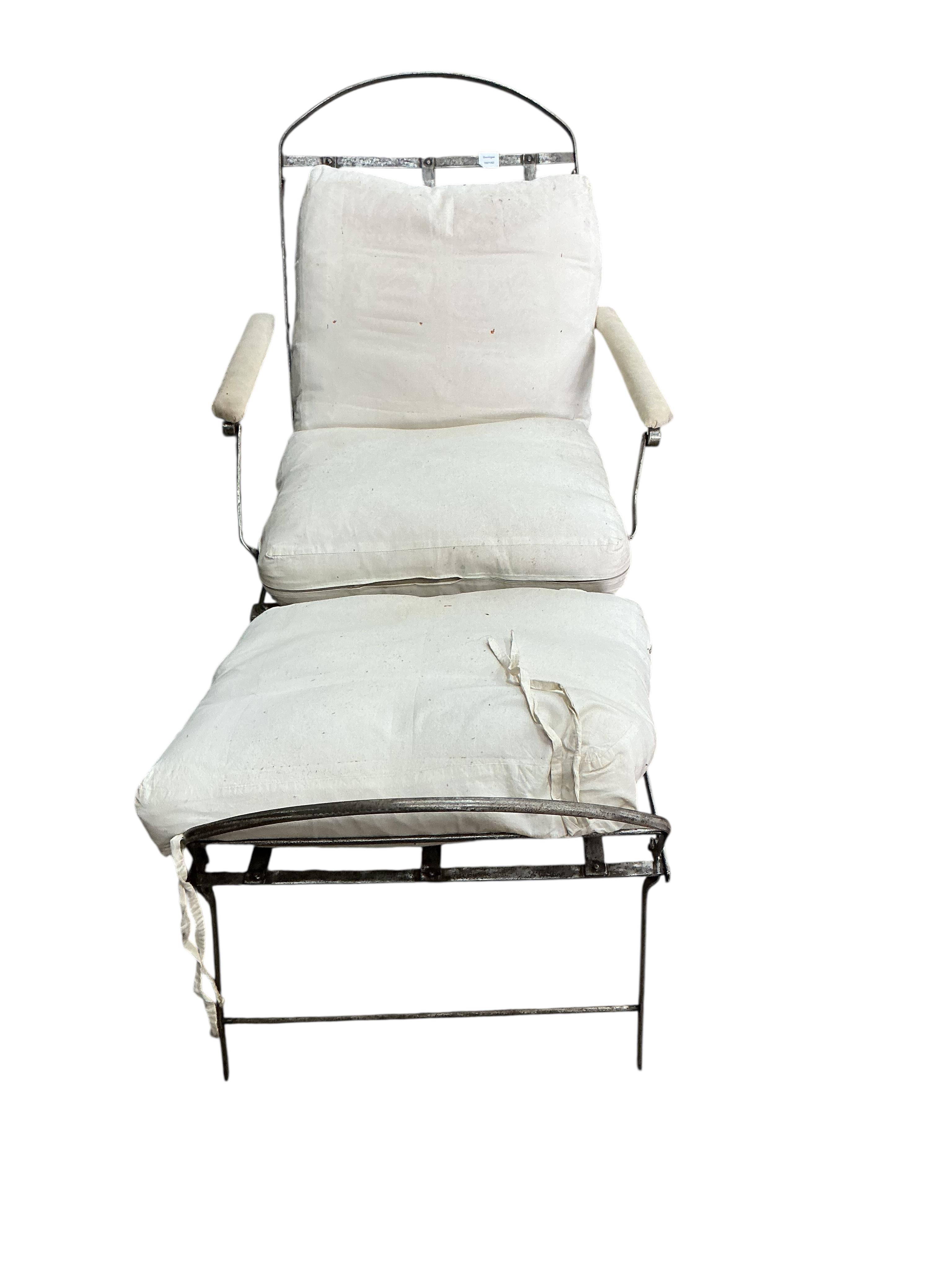 A 19th century wrought iron folding campaign day bed